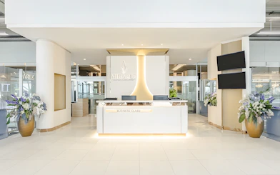 Miracle Lounge reception area at Bangkok Airport, Thailand, featuring business class services.