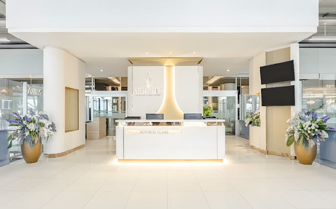 Miracle Lounge reception area at Bangkok Airport, Thailand, featuring business class services.
