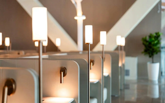 Waiting area with modern seating and lamps at Shanghai Pudong International Airport Terminal 2.