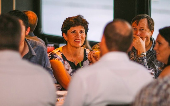 Guests dining on Odyssey Lake Michigan Dinner Cruise.