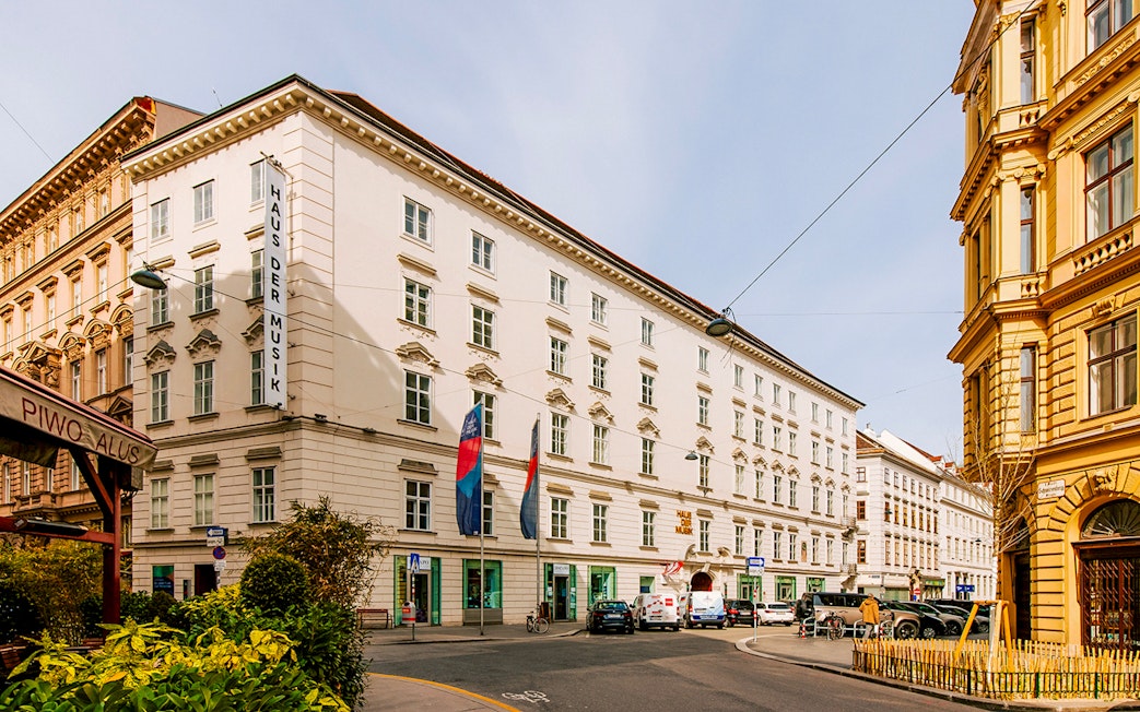 Haus der Musik exterior in Vienna, Austria, with street view and surrounding buildings.