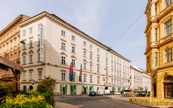 Haus der Musik exterior in Vienna, Austria, with street view and surrounding buildings.