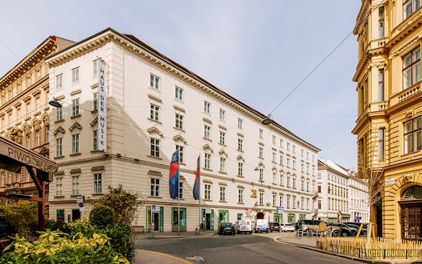 Haus der Musik exterior in Vienna, Austria, with street view and surrounding buildings.