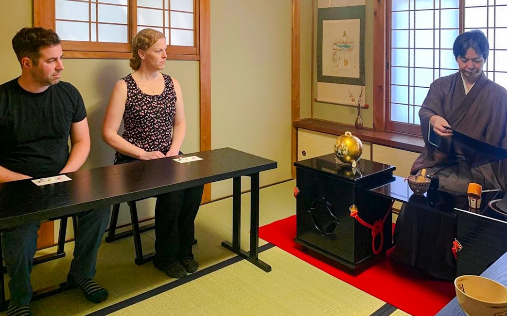 Guests participating in a traditional tea ceremony in Kyoto, Japan.