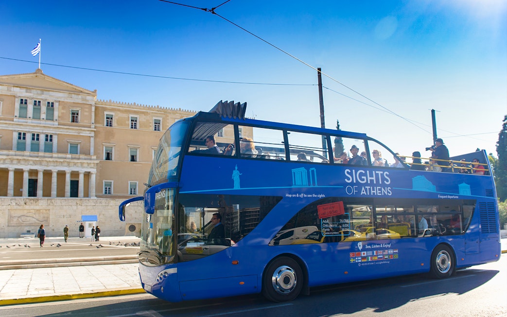 Open-top tour bus in front of the Hellenic Parliament, Athens.