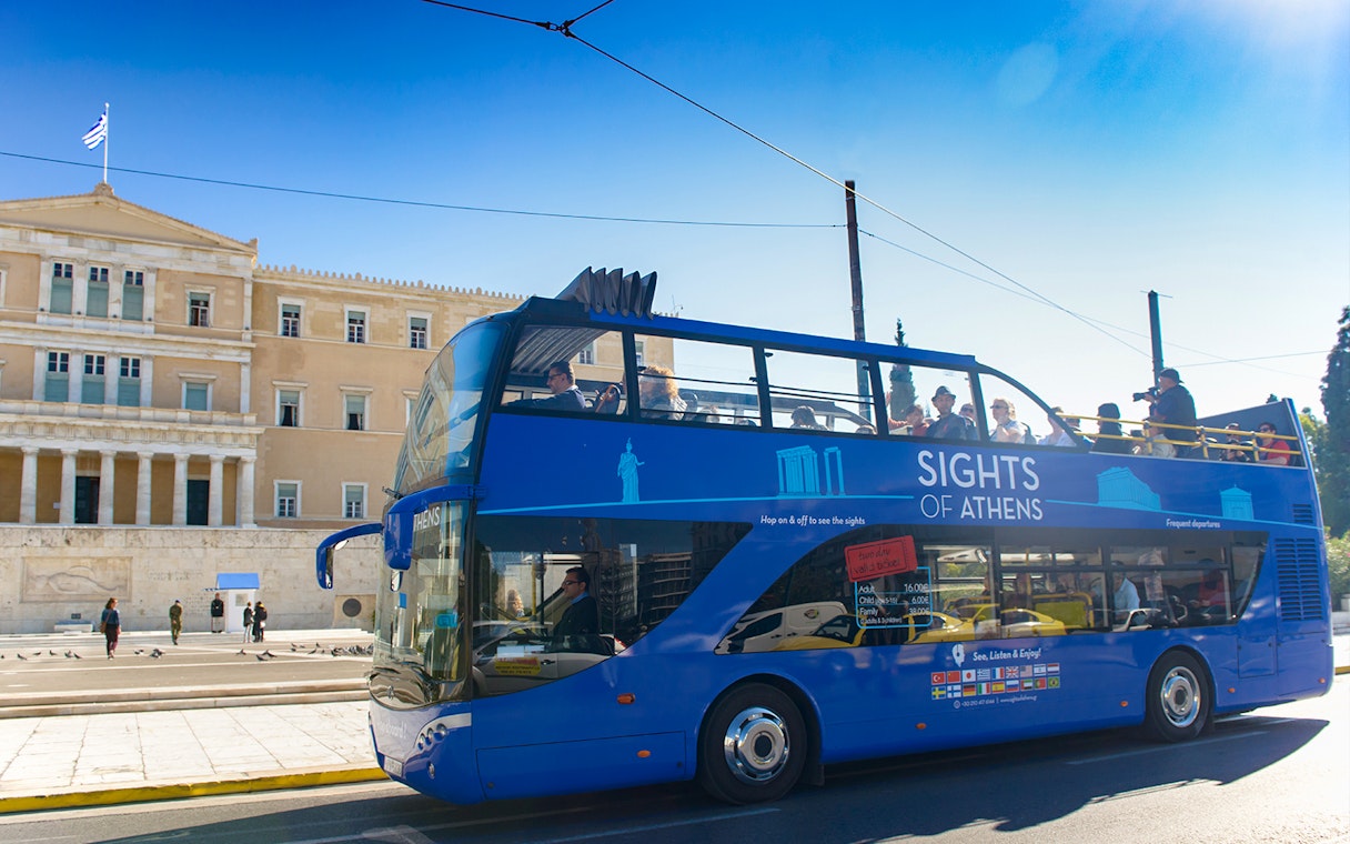 Open-top tour bus in front of the Hellenic Parliament, Athens.
