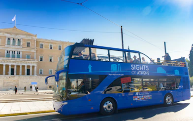 Open-top tour bus in front of the Hellenic Parliament, Athens.