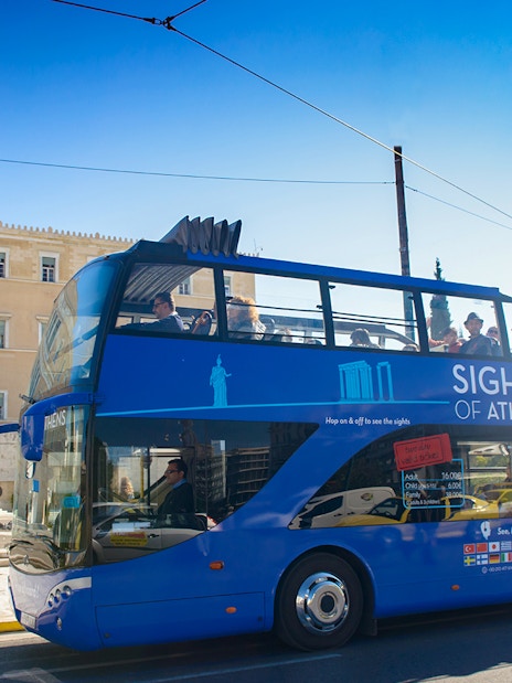 Open-top tour bus in front of the Hellenic Parliament, Athens.