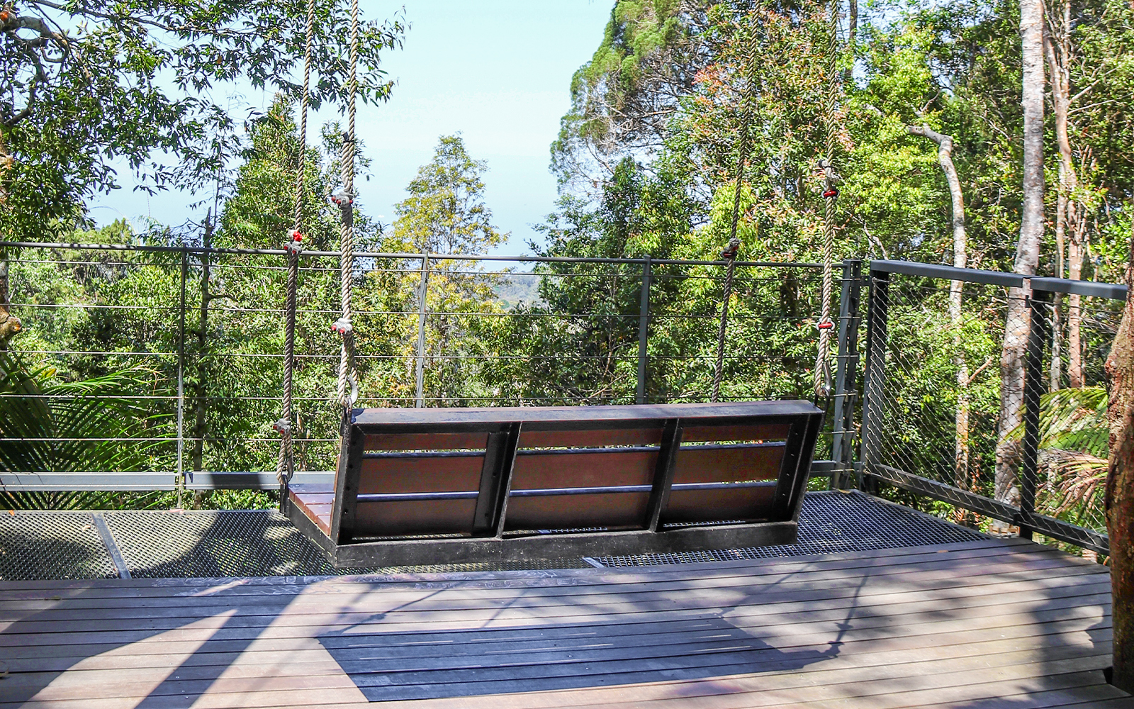 Giant swings overlooking lush greenery at Habitat Penang Hill, Malaysia