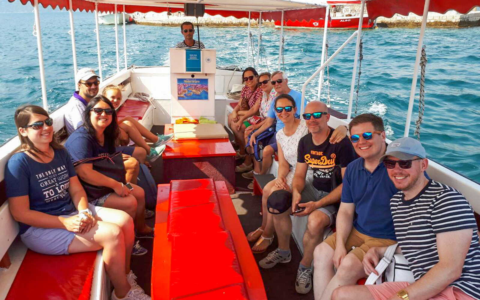 Tourists enjoying a boat ride from Dubrovnik to Kotor and Perast in Montenegro.