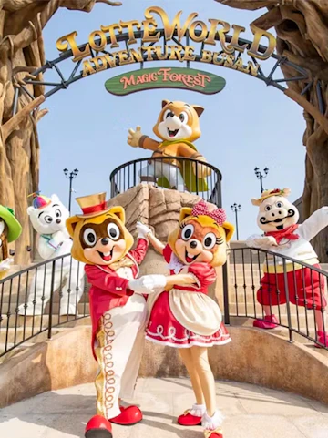 Characters in costumes at Lotte World Adventure, Busan's Magic Forest entrance.