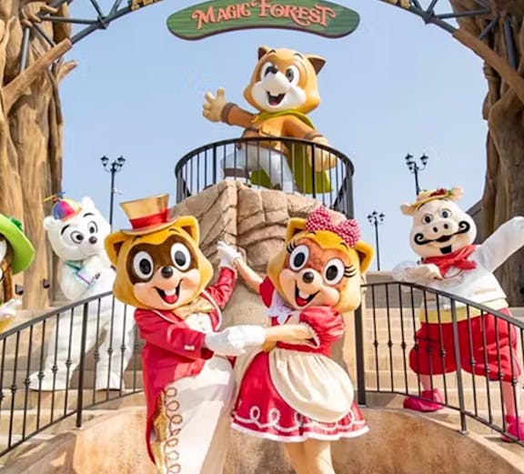 Characters in costumes at Lotte World Adventure, Busan's Magic Forest entrance.