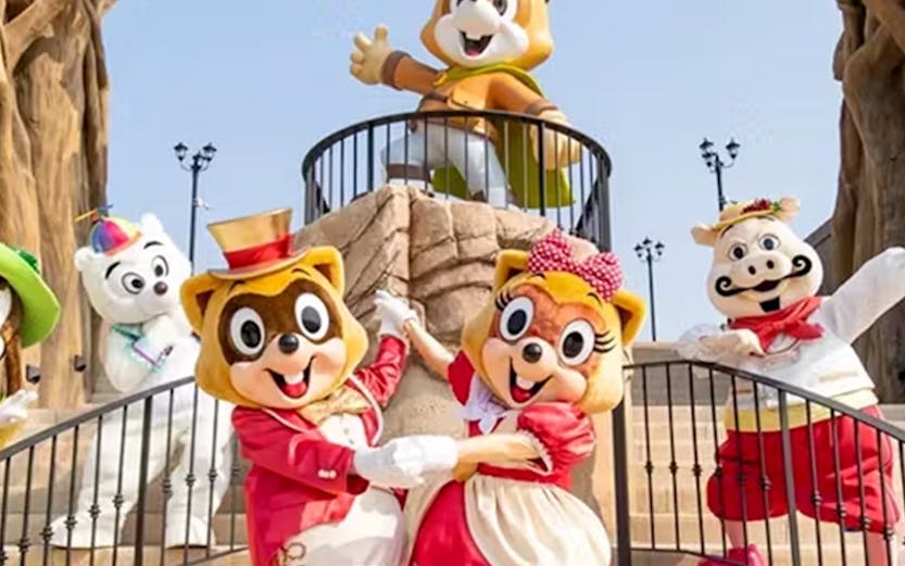 Characters in costumes at Lotte World Adventure, Busan's Magic Forest entrance.