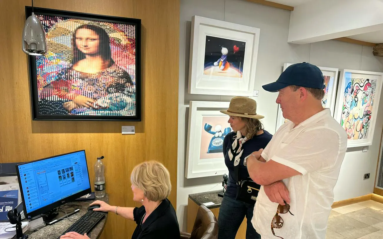 Art gallery visitors viewing paintings during North Cotswolds antiques shopping tour, Oxford.
