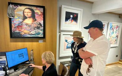 Art gallery visitors viewing paintings during North Cotswolds antiques shopping tour, Oxford.