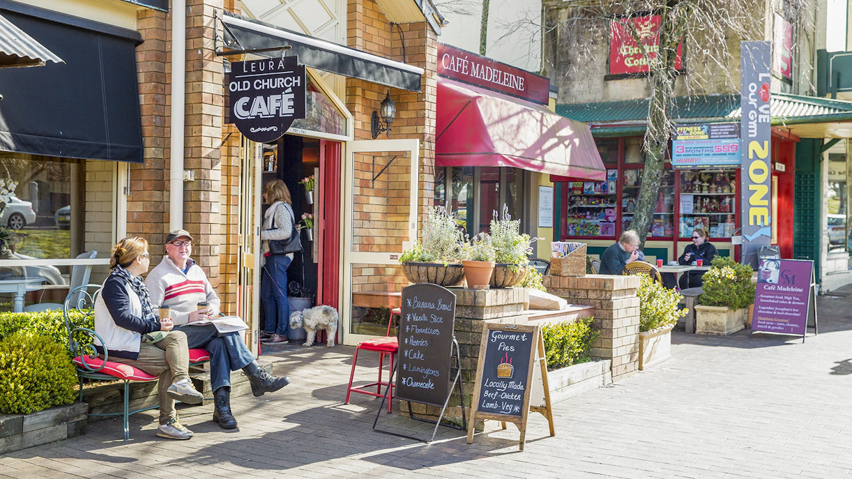 Cafes in Leura Village, Blue Mountains with people enjoying outdoor seating.