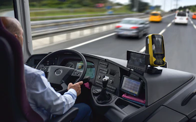 Driver operating Regio Jet bus on highway from Prague.