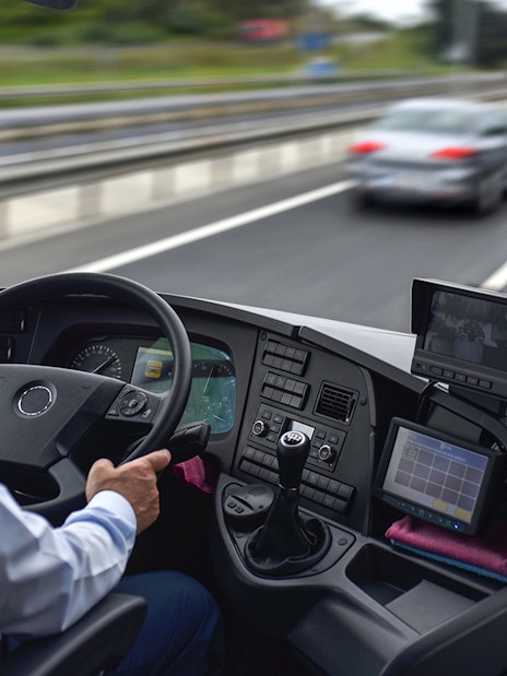 Driver operating Regio Jet bus on highway from Prague.