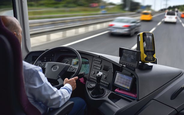 Driver operating Regio Jet bus on highway from Prague.