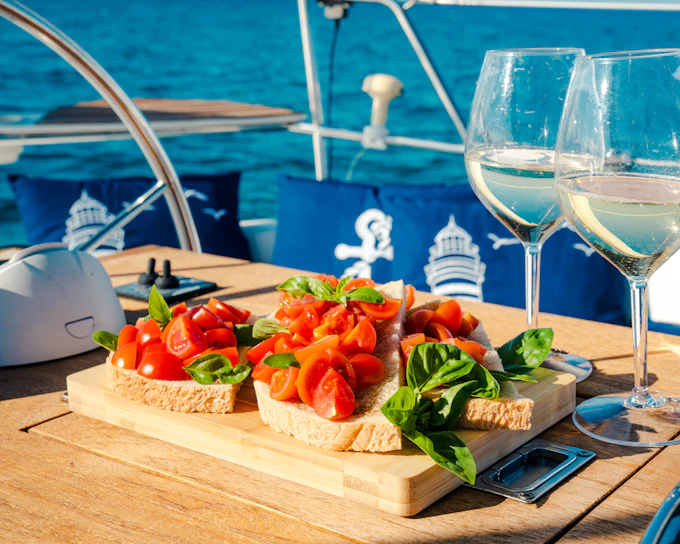 Capo Comino Small-Group Sailing Cruise with Lunch and Snorkeling