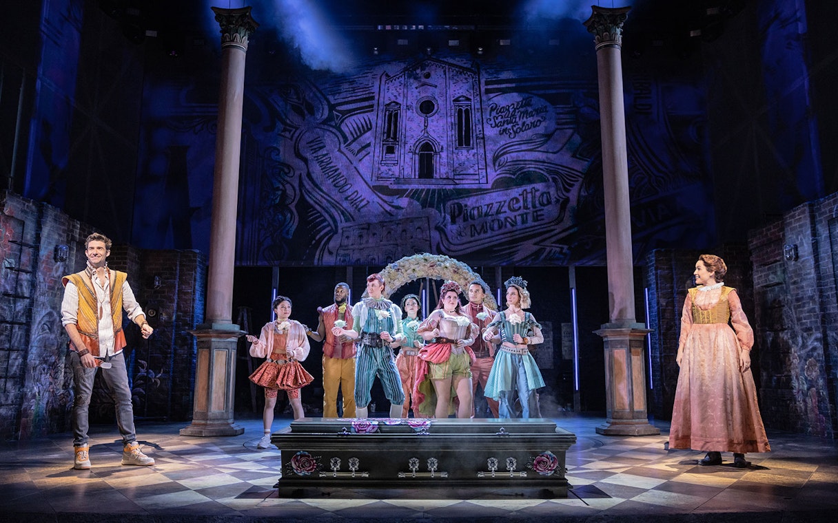 Stage performance of "& Juliet" with actors in period costumes.