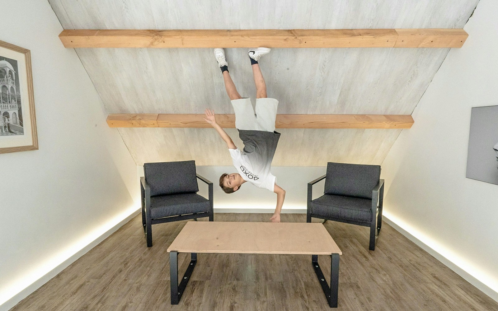 Guest experiencing an upside-down room at the Museum of Illusions Amsterdam.
