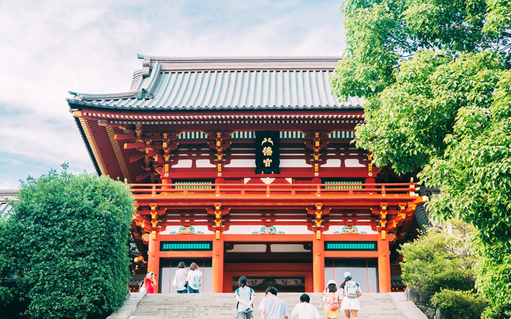 Kamakura Tsurugaoka Hachimangu Shrine entrance with visitors, Japan.