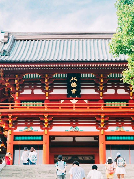 Kamakura Tsurugaoka Hachimangu Shrine entrance with visitors, Japan.