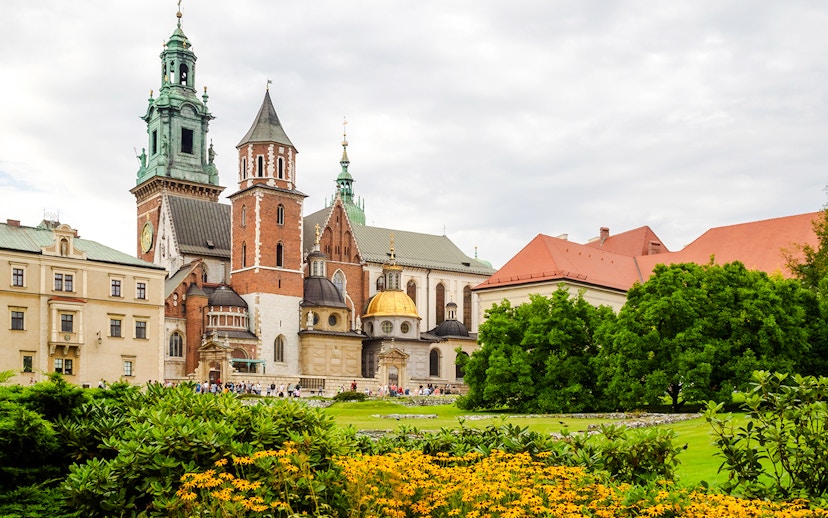 Wawel Castle and Cathedral in Krakow with gardens in the foreground.