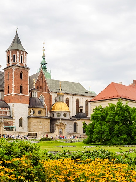 Wawel Castle and Cathedral in Krakow with gardens in the foreground.