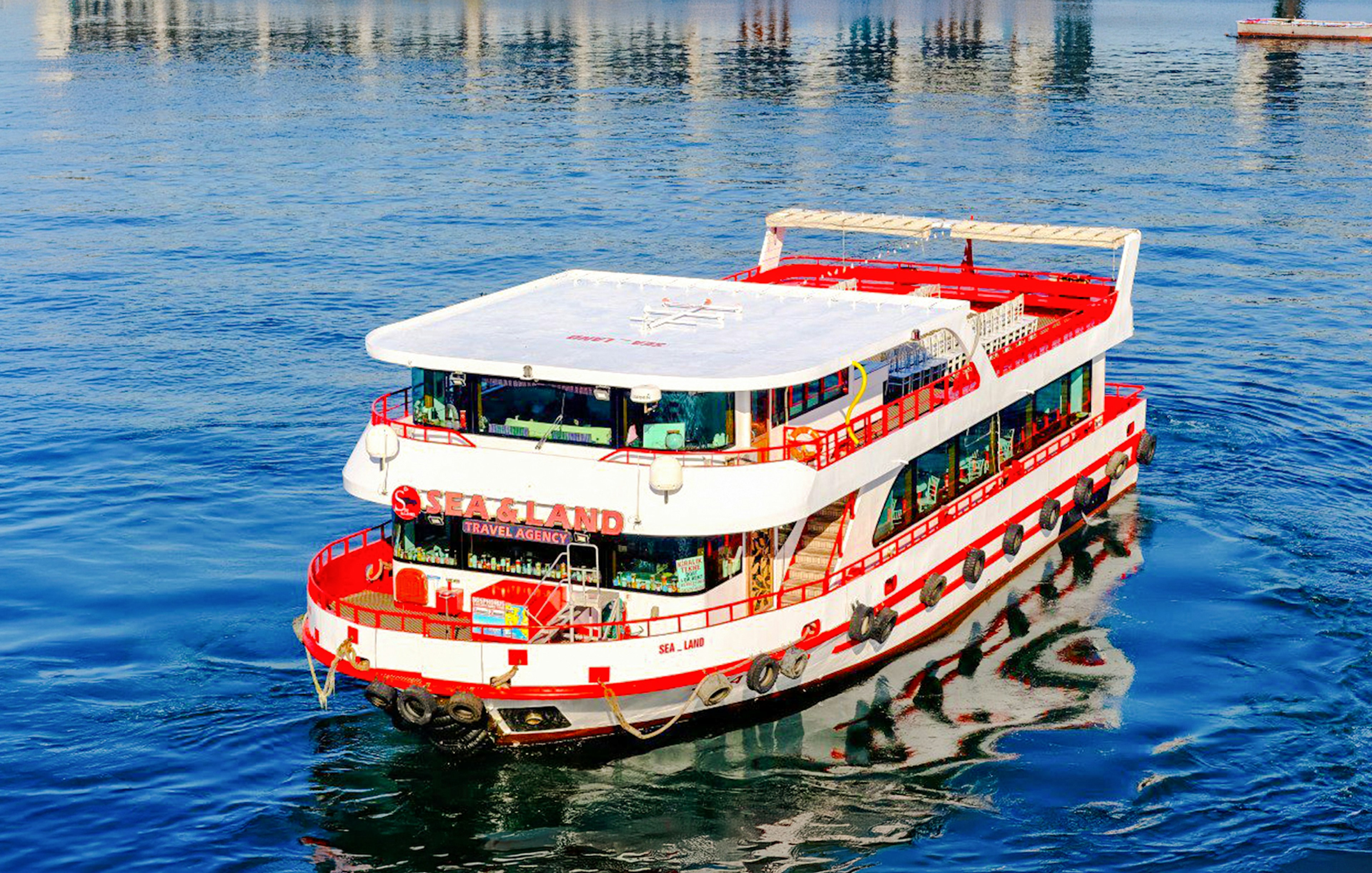 Bosphorus cruise ship on blue water in Istanbul.