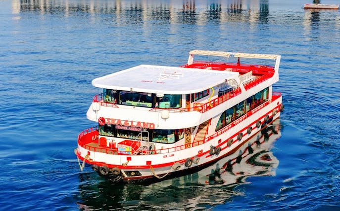Bosphorus cruise ship on blue water in Istanbul.