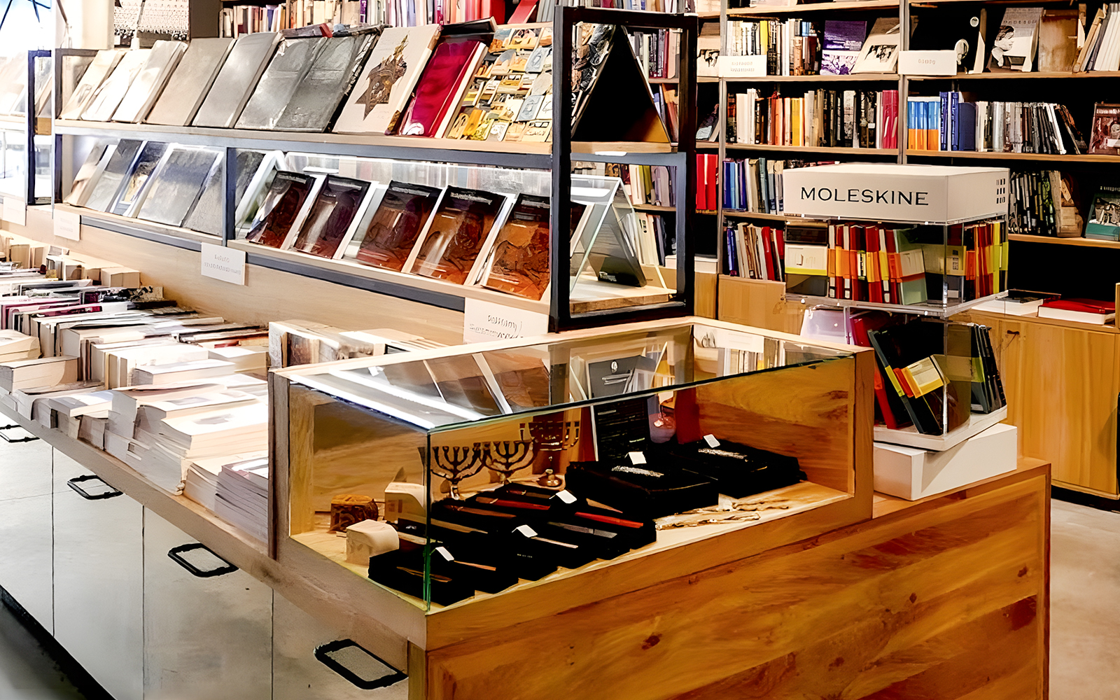 Books and souvenirs displayed at Galicia Jewish Museum gift shop in Kraków.