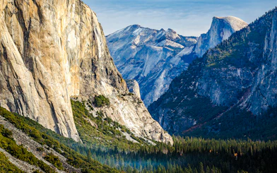 Yosemite Valley with view of Half Dome and surrounding granite cliffs.