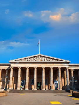 British Museum entrance with columns and sculptures, London, UK.