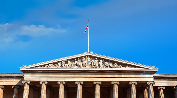 British Museum entrance with columns and sculptures, London, UK.
