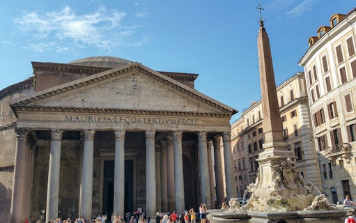 Pantheon and obelisk in Rome's Piazza della Rotonda during guided tour.