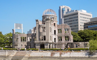 Hiroshima Peace Memorial with surrounding cityscape on sightseeing bus tour.