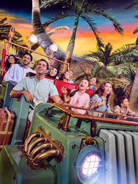 Visitors enjoying a dinosaur-themed ride at IMG Worlds of Adventure, Dubai.