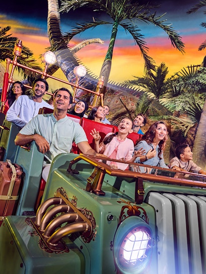 Visitors enjoying a dinosaur-themed ride at IMG Worlds of Adventure, Dubai.