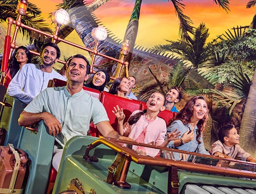Visitors enjoying a dinosaur-themed ride at IMG Worlds of Adventure, Dubai.