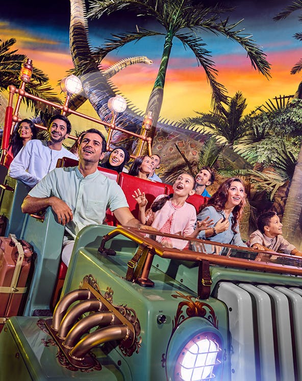 Visitors enjoying a dinosaur-themed ride at IMG Worlds of Adventure, Dubai.