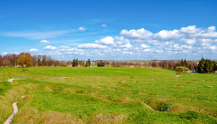 Beaumont Hamel battlefield with preserved trenches and grassy landscape.