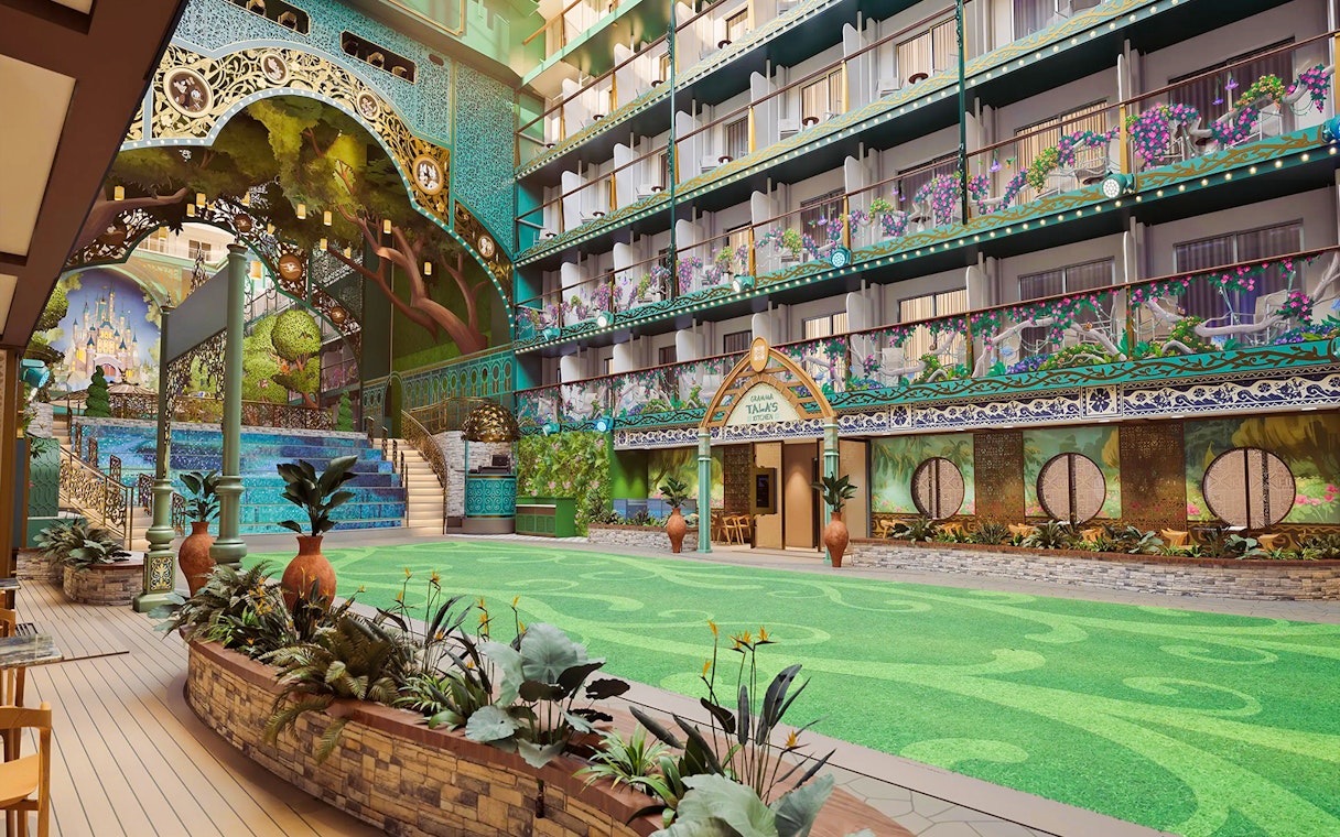 Disney Imagination Garden atrium with vibrant murals and lush greenery on Disney Adventure Cruise.