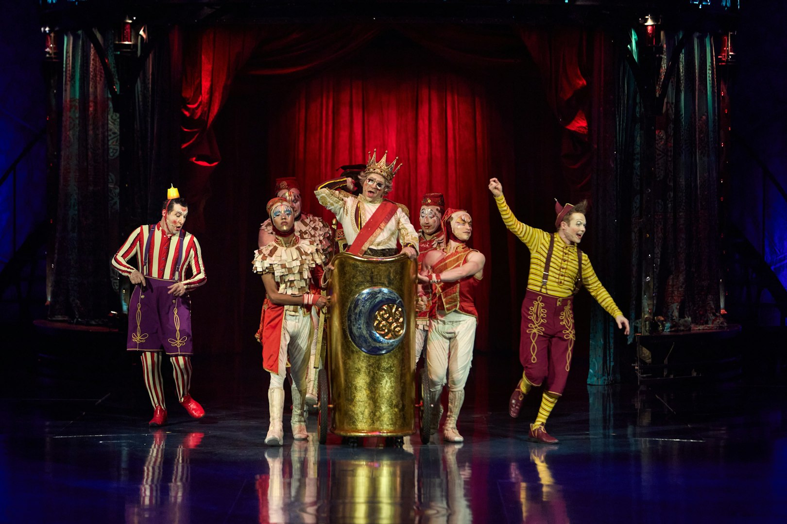 Performers in colorful costumes on stage during Kooza show in Brisbane.