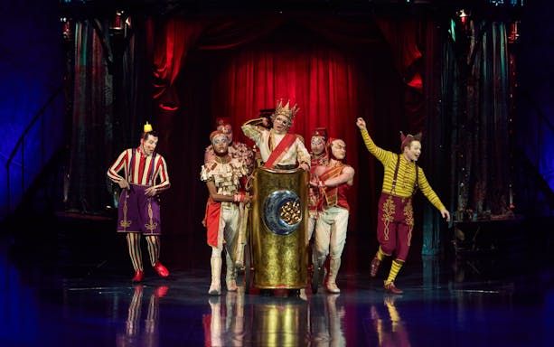 Performers in colorful costumes on stage during Kooza show in Brisbane.