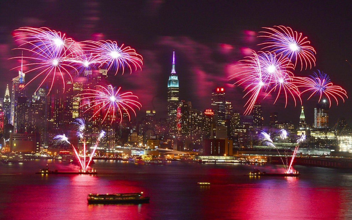Fireworks over New York City skyline during New Year’s Eve cruise.