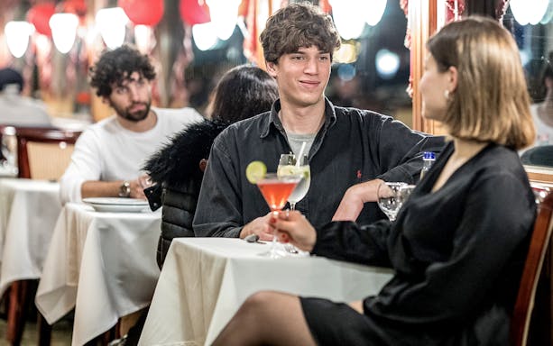 Guests enjoying drinks on a Danube sightseeing cruise.