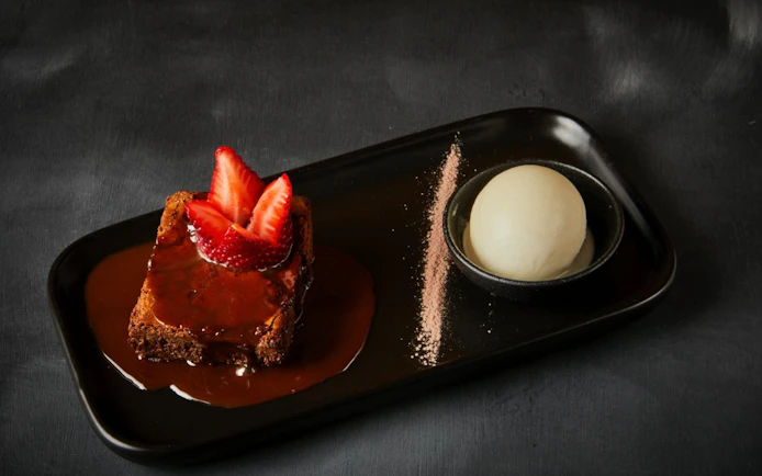 Choco fudge cake with strawberries and ice cream served at Cairns Aquarium by Twilight dining.