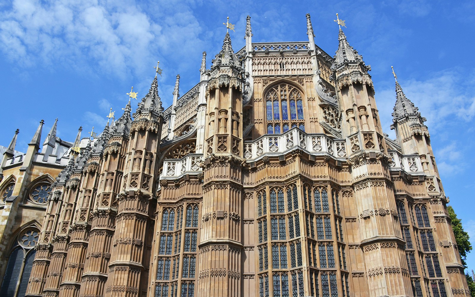 Exterior view of Henry VII Chapel's ornate Gothic architecture at Westminster Abbey.